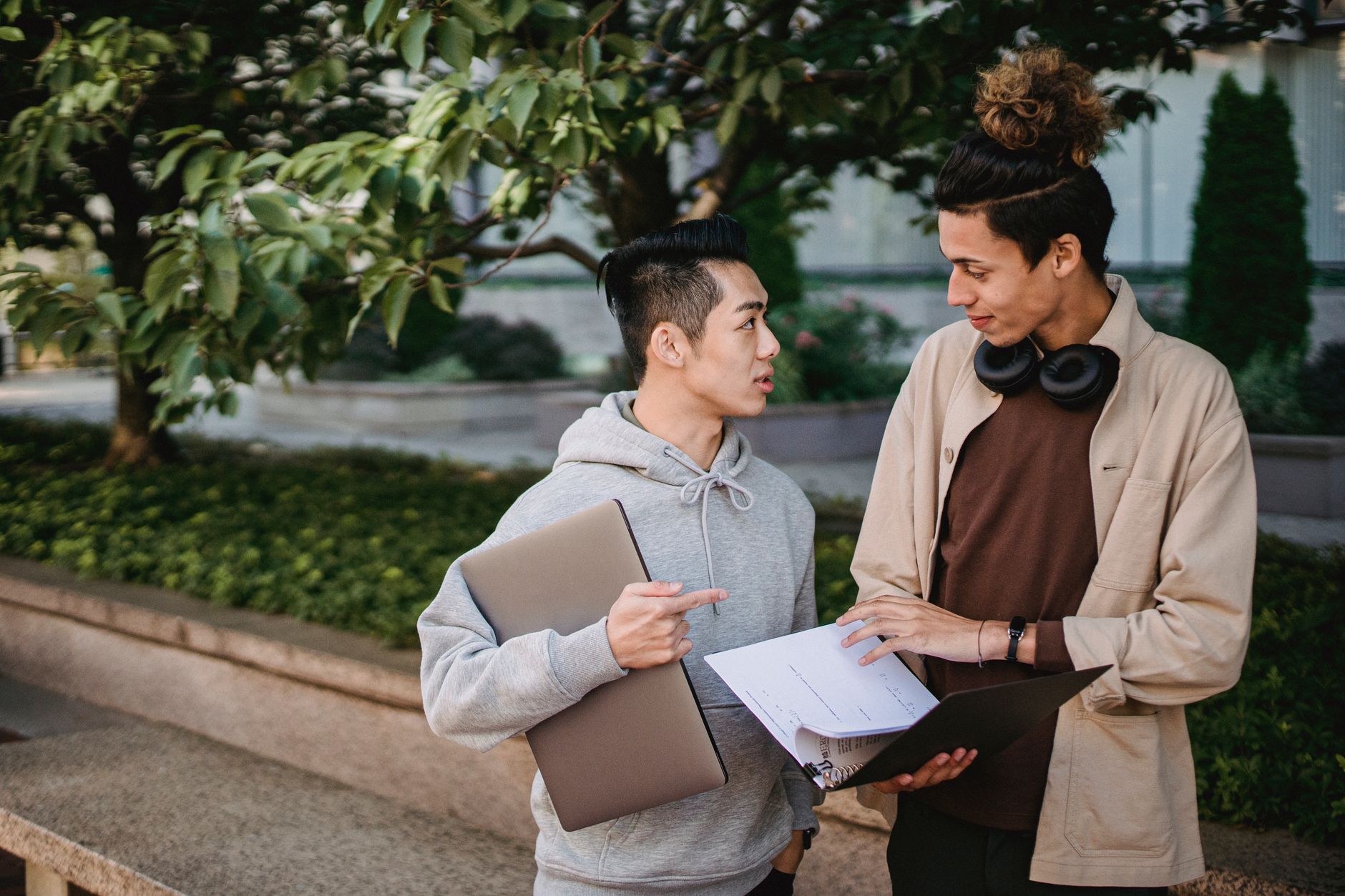 photographic | student discussing transfer course equivalency worksheet with an academic advisor